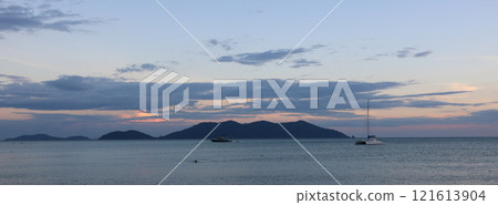 Catamaran and Ko Khlum, small island at sunset, view from Klong Kloi Beach, Ko Chang, Thailand. 121613904