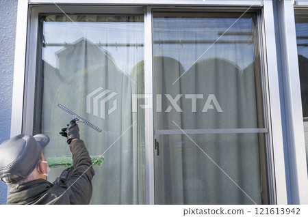 Glass cleaning by a specialist Glass cleaning by a specialist 121613942