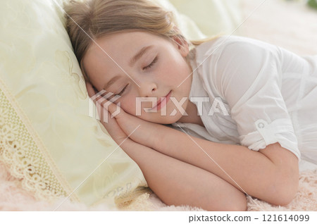 Adorable cute little girl sleeping in bed Adorable cute little girl sleeping in bed 121614099