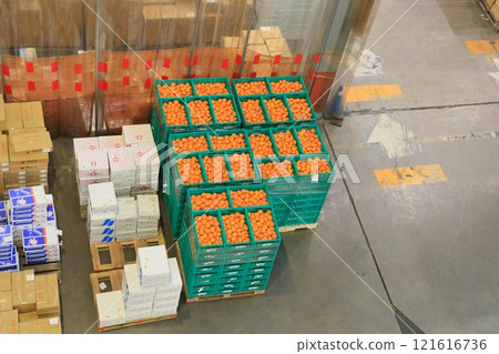 Ota Market at the end of the year: piles of cardboard boxes containing fruits and vegetables Ota Market at the end of the year: piles of cardboard boxes containing fruits and vegetables 121616736