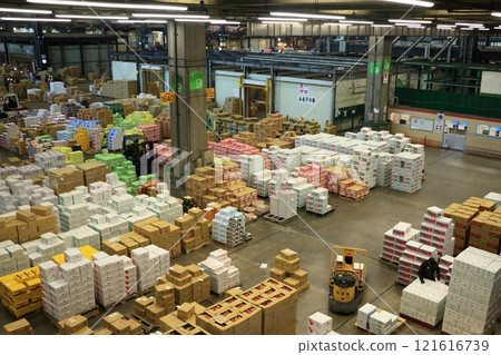 Ota Market at the end of the year: piles of cardboard boxes containing fruits and vegetables 121616739