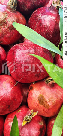 Fresh pomegranate at local market. 121617582