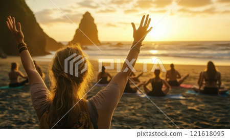 Group yoga session on a beach at sunset, concept of wellness, relaxation, and mindfulness. Group yoga session on a beach at sunset, concept of wellness, relaxation, and mindfulness. 121618095