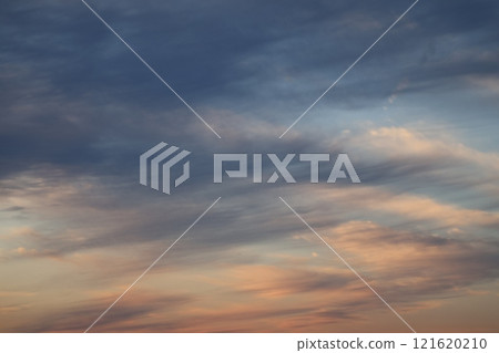 Evening scenery with gray and crimson clouds and blue sky 121620210