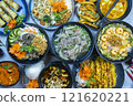 Asian feast: vibrant flavors, colorful dishes, full table 121620221