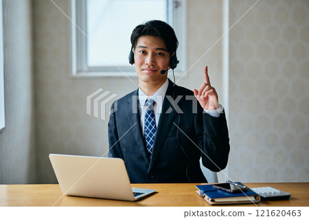 A young man in his 20s doing a one-point pose A young man in his 20s doing a one-point pose 121620463