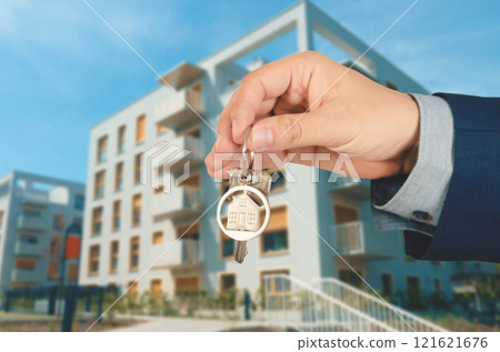 Real estate agent giving the keys Real estate agent giving the keys 121621676