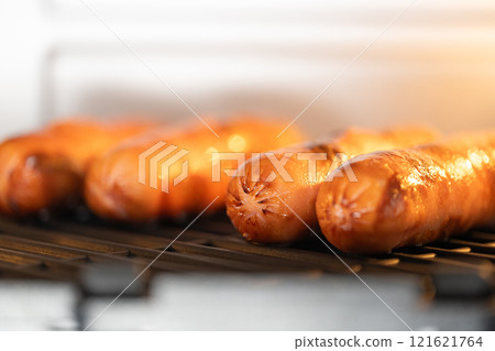 grilled sausages in the oven 121621764