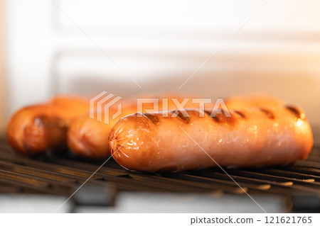 grilled sausages in the oven grilled sausages in the oven 121621765