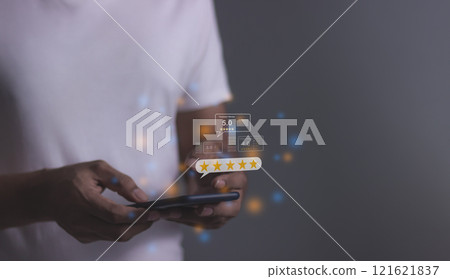 Young Man hand using smartphone mobile with five star to review and give 5 stars Young Man hand using smartphone mobile with five star to review and give 5 stars 121621837