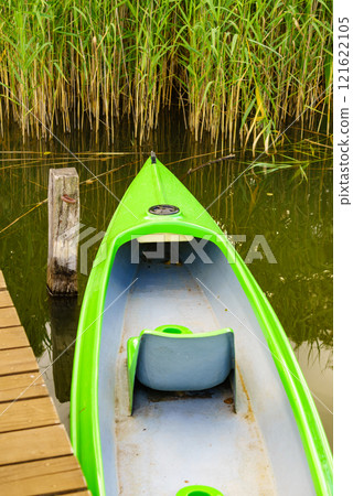 Boat on lake shore Boat on lake shore 121622105