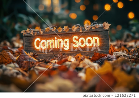 Cozy Autumn Announcement with Glowing Coming Soon Sign on Rustic Wood 121622271