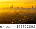 Orange-tinted morning mist 121622898