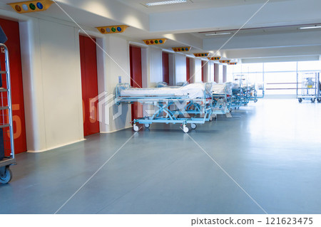 Clean hospital beds covered with film, ready for new patients. 121623475