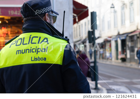Lisbon, Portugal - December 11, 2024: Back turned Municipal Police of Lisbon officer Lisbon, Portugal - December 11, 2024: Back turned Municipal Police of Lisbon officer 121624431