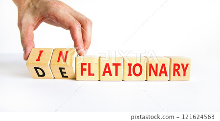 Deflationary or inflationary symbol. Concept words Deflationary Inflationary on wooden blocks. Beautiful white background. Businessman hand. Business deflationary inflationary concept. Copy space 121624563