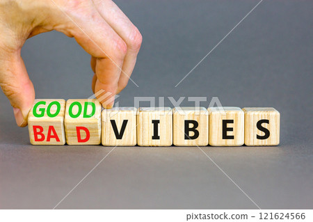 Good or bad vibes symbol. Concept words Good vibes Bad vibes on beautiful wooden blocks. Beautiful grey table grey background. Businessman hand. Business good or bad vibes concept. Copy space 121624566