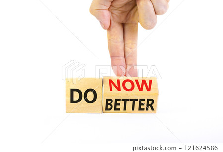 Do better and now symbol. Concept words Do better Do now on wooden block. Beautiful white table white background. Businessman hand. Business do better and now concept. Copy space. Do better and now symbol. Concept words Do better Do now on wooden block. Beautiful white table white background. Businessman hand. Business do better and now concept. Copy space. 121624586