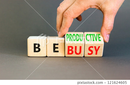 Be productive not busy symbol. Concept words Be productive Be busy on wooden block. Beautiful grey table grey background. Businessman hand. Business be productive not busy concept. Copy space. 121624605