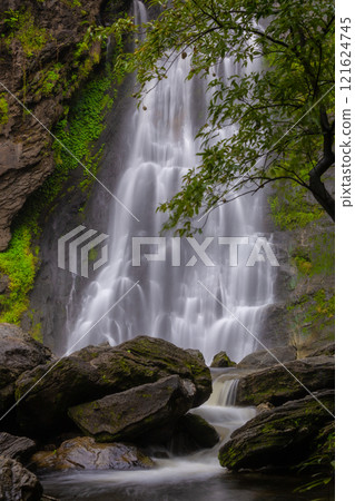 Klong Lan Waterfall is one of the most beautiful and grand waterfalls in Thailand. Below it is a large pool where you can swim. It is located in Khlong Lan Waterfall National Park, Kamphaeng Phet. 121624745