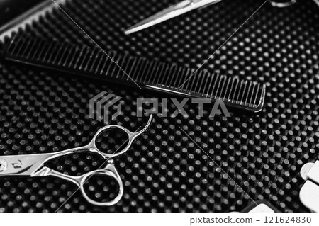 Professional hairdressing tools arranged neatly on a styling workstation Professional hairdressing tools arranged neatly on a styling workstation 121624830