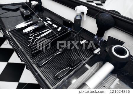Tools of the trade arranged neatly on a barber shop counter Tools of the trade arranged neatly on a barber shop counter 121624856