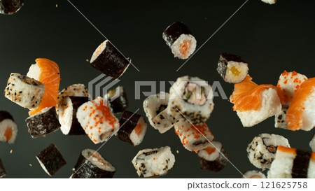 Freeze Motion Shot of Fresh Sushi Flying in the Air , Close-up Freeze Motion Shot of Fresh Sushi Flying in the Air , Close-up 121625758