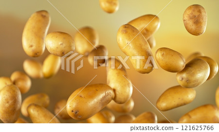 Freeze motion of flying early potatoes , Close-up 121625766