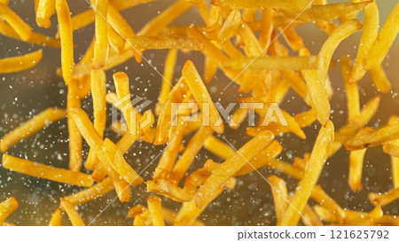 Freeze motion of flying french fries on gradient background 121625792