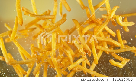 Freeze motion of flying french fries on gradient background 121625796