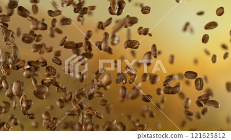 Freeze Motion Shot of Flying Coffee Beans After Being Exploded Freeze Motion Shot of Flying Coffee Beans After Being Exploded 121625812