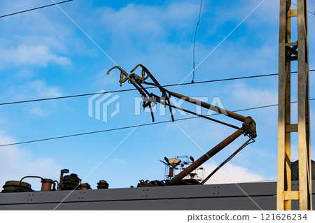 An electric train is seen above the platform, showcasing its sophisticated design and intricate rail network An electric train is seen above the platform, showcasing its sophisticated design and intricate rail network 121626234