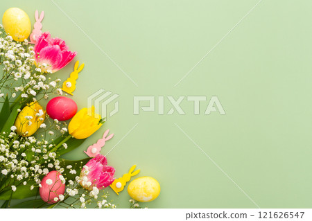 Easter eggs with tulips and gypsophila and decorative bunnies 121626547