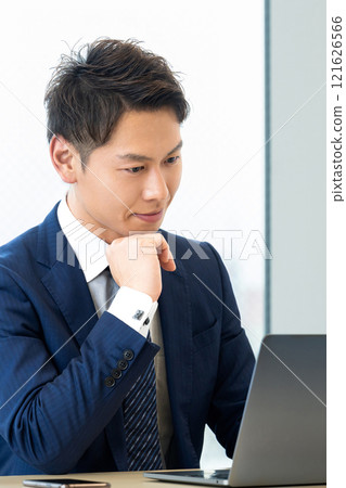 Male businessman using a laptop 121626566