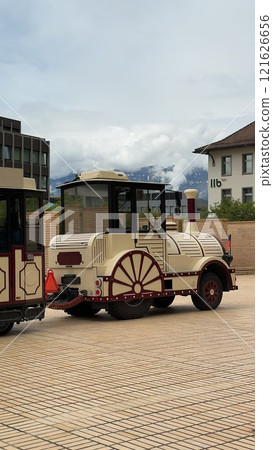 Vintage-Style Train Carriage Displayed Outdoors on a Cityside of Liechtenstein, Vaduz Vintage-Style Train Carriage Displayed Outdoors on a Cityside of Liechtenstein, Vaduz 121626656
