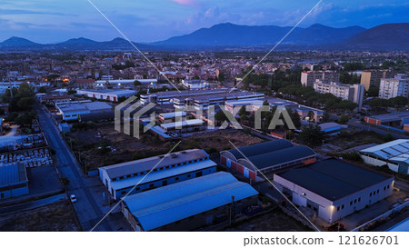 Industrial area with factories and warehouses at dusk in the outskirts 121626701