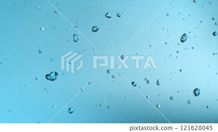 Freeze motion of falling water drops on blue background Freeze motion of falling water drops on blue background 121628045