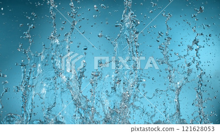 Freeze motion of splashing water on light blue background Freeze motion of splashing water on light blue background 121628053