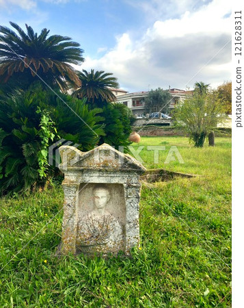 Ancient grave with tombstone under excavation Ancient grave with tombstone under excavation 121628311