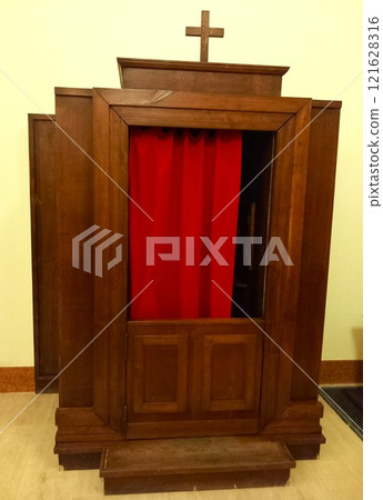 Confession booth in a Catholic church 121628316