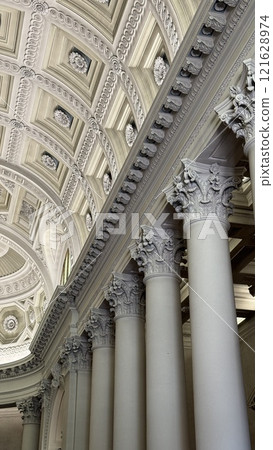 Intricate Architectural Ceiling and Pillars of a Historic Building Interior 121628974