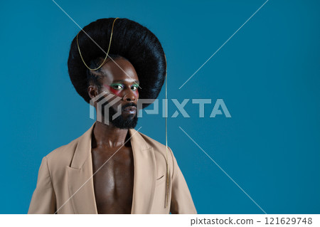 Serious black gay model wearing huge wig with Serious black gay model wearing huge wig with 121629748