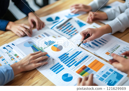 A business team brainstorming and planning financial strategies. The concept of collaboration, innovation, and strategic decision-making in business. Generative AI. 121629989