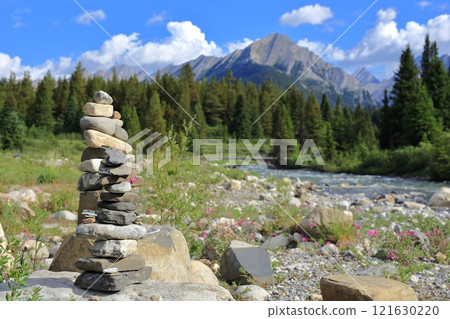 Spring stream, Rocky Mountains and cairns 121630220
