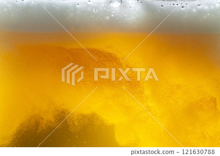 A scene of cold beer being poured into a glass and foam appearing A scene of cold beer being poured into a glass and foam appearing 121630788