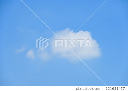 beautiful blue sky and white fluffy single cloud with sunrise in the morning, natural background 121631457