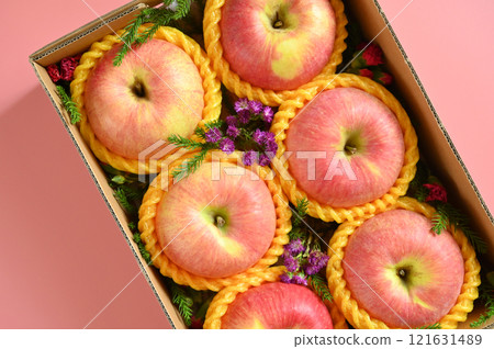 beautiful pink apple in the box on pink background beautiful pink apple in the box on pink background 121631489