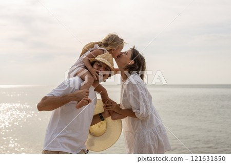 Family happy relaxing on beach children mother father travel summer vacation together sea holiday tropical Sunset time. Trip enjoying bonding. Family day having fun. 121631850