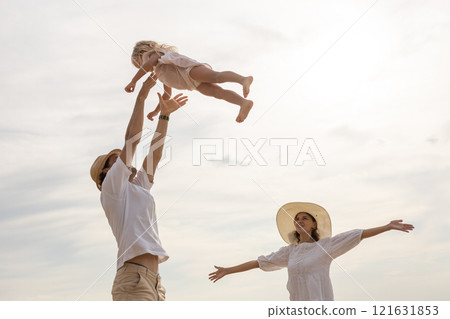 Family happy relaxing on beach children mother father travel summer vacation together sea holiday tropical Sunset time. Trip enjoying bonding. Family day having fun. Family happy relaxing on beach children mother father travel summer vacation together sea holiday tropical Sunset time. Trip enjoying bonding. Family day having fun. 121631853