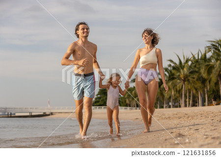 Family happy relaxing on beach children mother father travel summer vacation together sea holiday tropical Sunset time. Trip enjoying bonding. Family day having fun. Family happy relaxing on beach children mother father travel summer vacation together sea holiday tropical Sunset time. Trip enjoying bonding. Family day having fun. 121631856